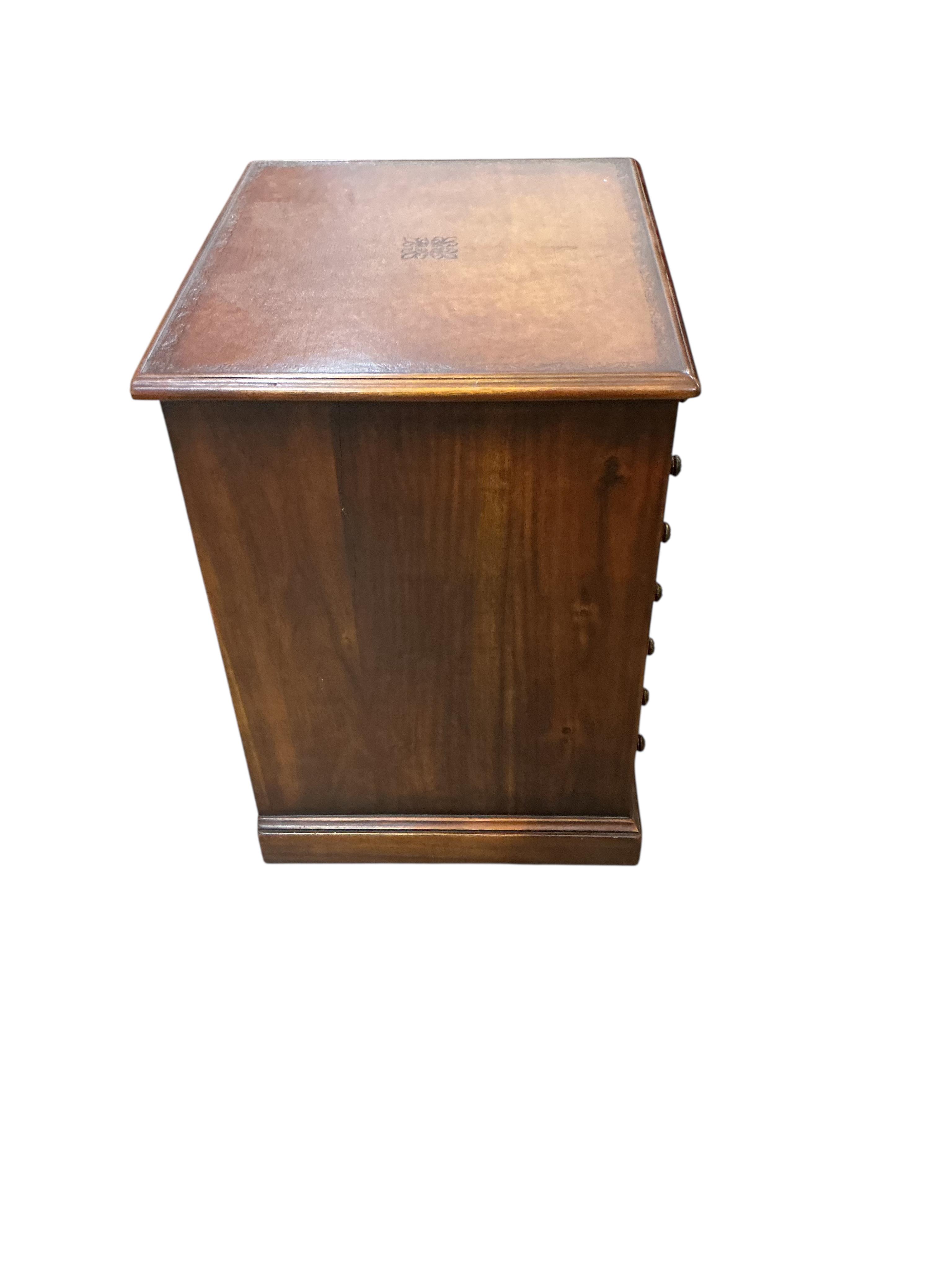 A reproduction mahogany seven drawer collector's chest with leather inset top, width 48cm, depth 40cm, height 56cm
